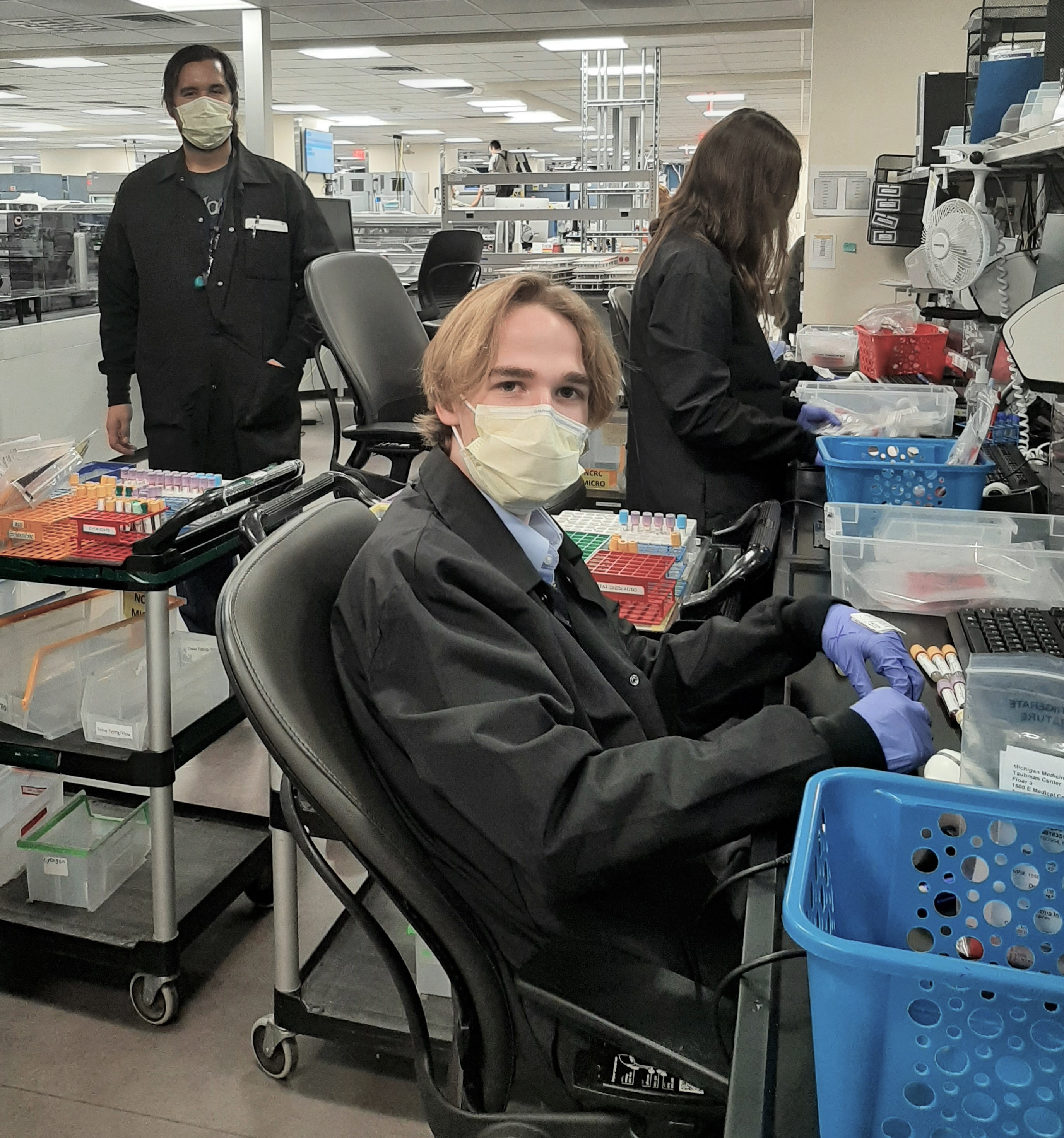 John Merrill, Colin Smith and Kierstin Abbott receive specimens for processing